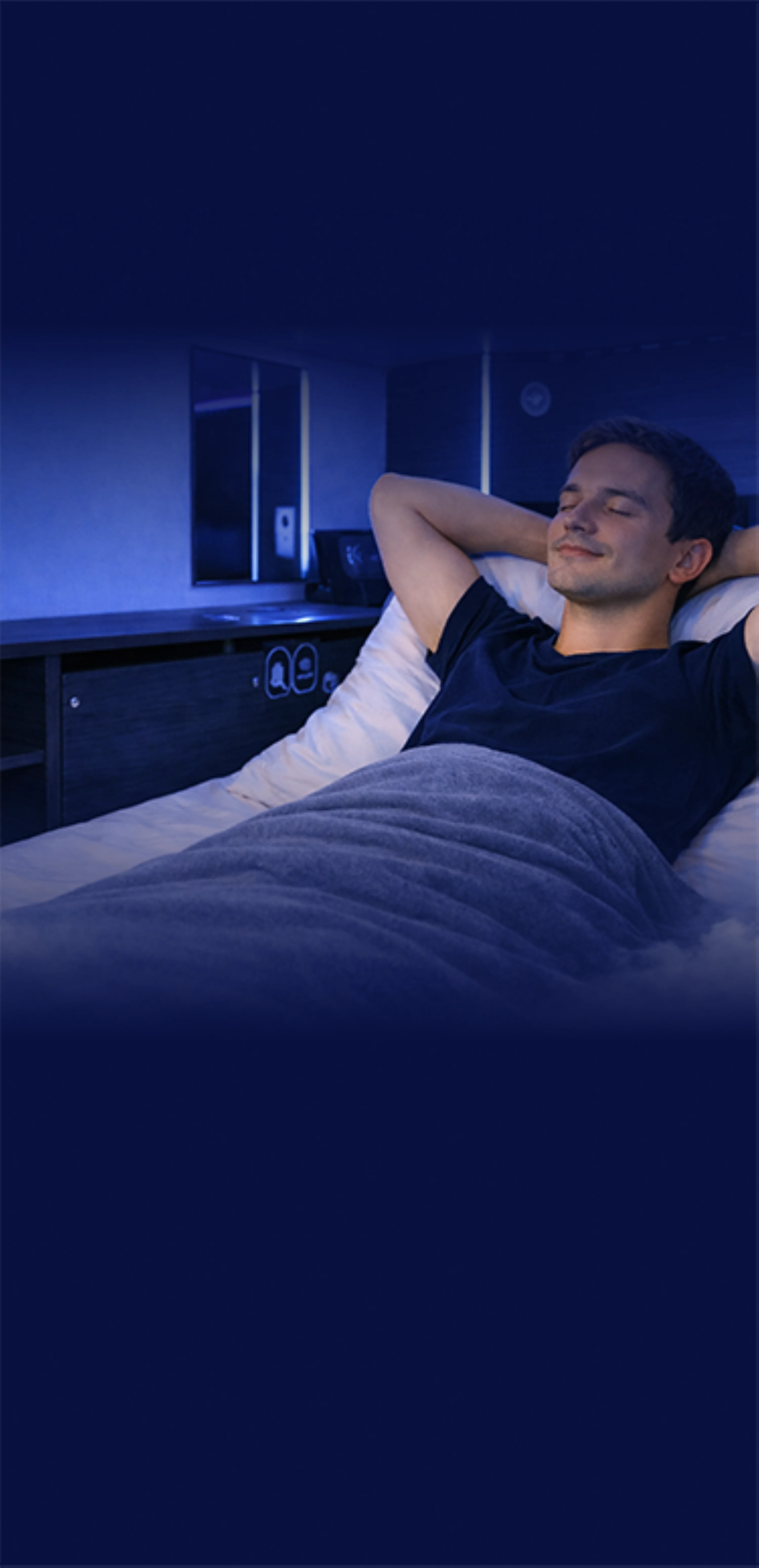 Guest relaxing inside a private airport sleeping pod at Kepler transit hotel and sleep lounge
